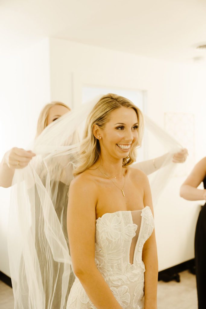 bride getting ready for black and white themed wedding 